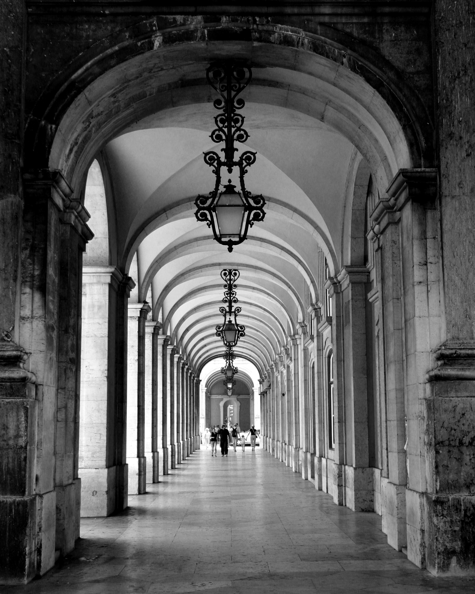 A,Vertical,Shot,Of,An,Old,Archway,Corridor,With,Unlit